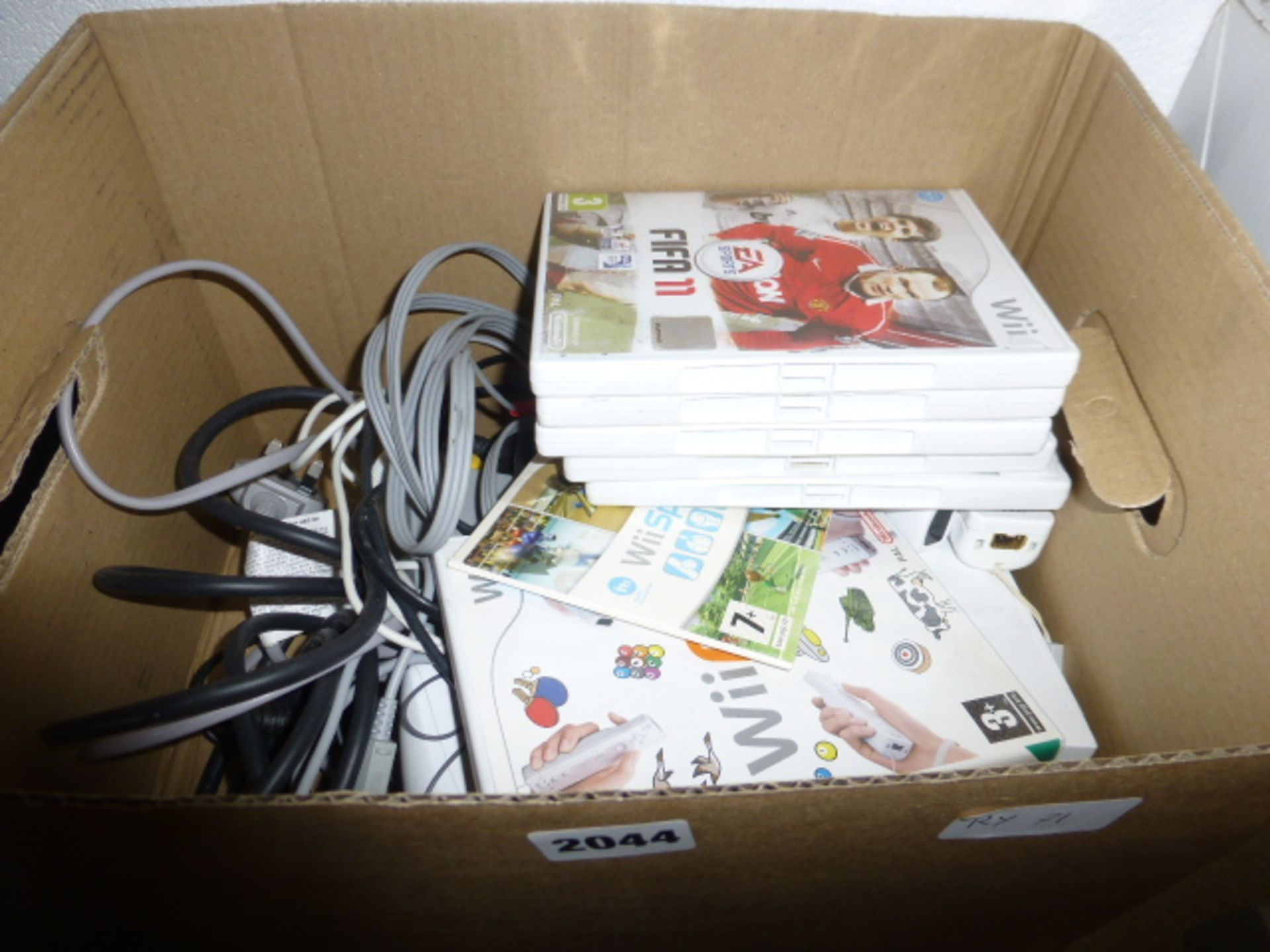 Nintendo Wii console with games and accessories in box