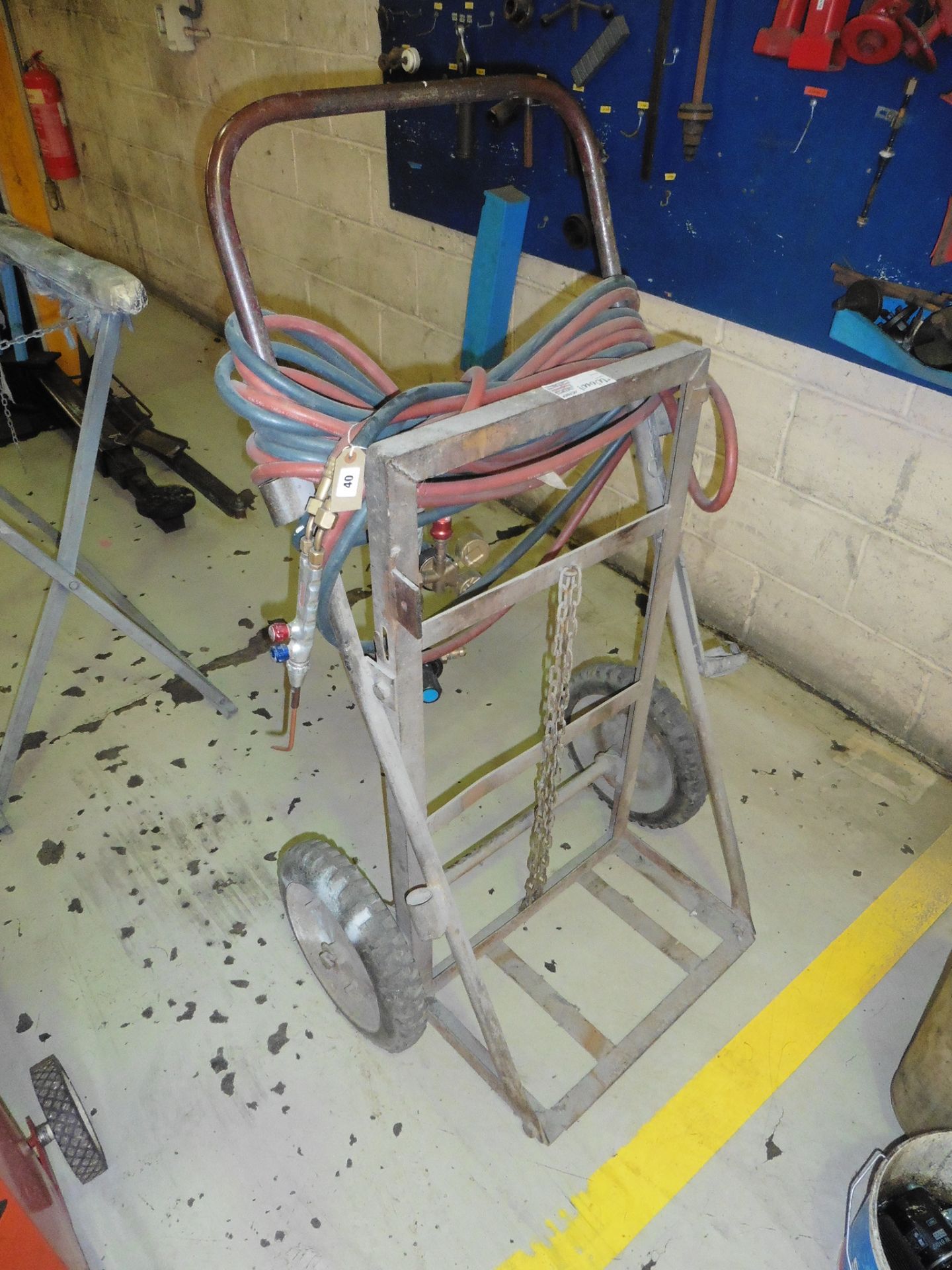 Set of oxy-acetylene welding gear with hose, gauges and trolley