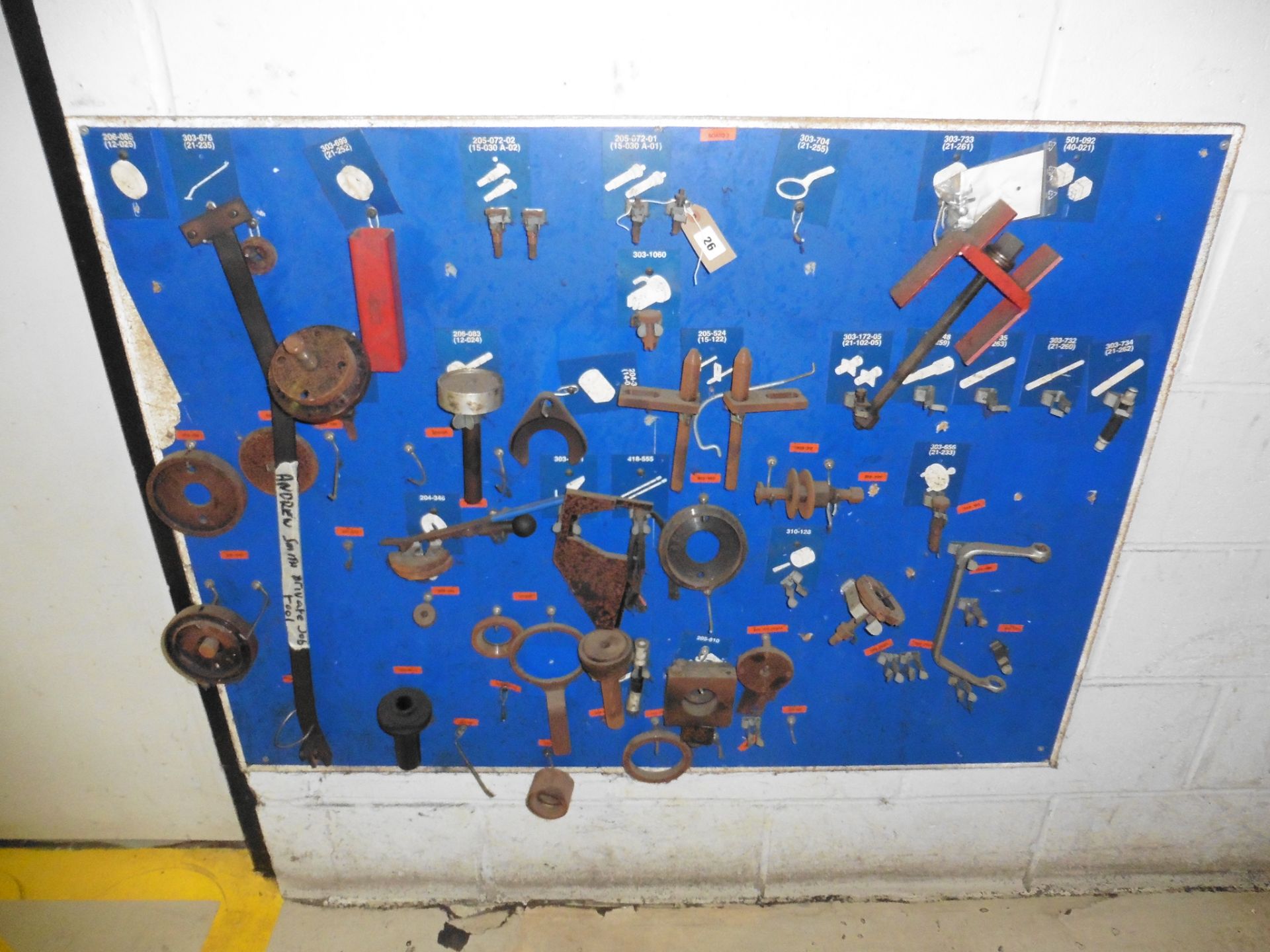 Wall mounted rack of specialist engine tools and jigs