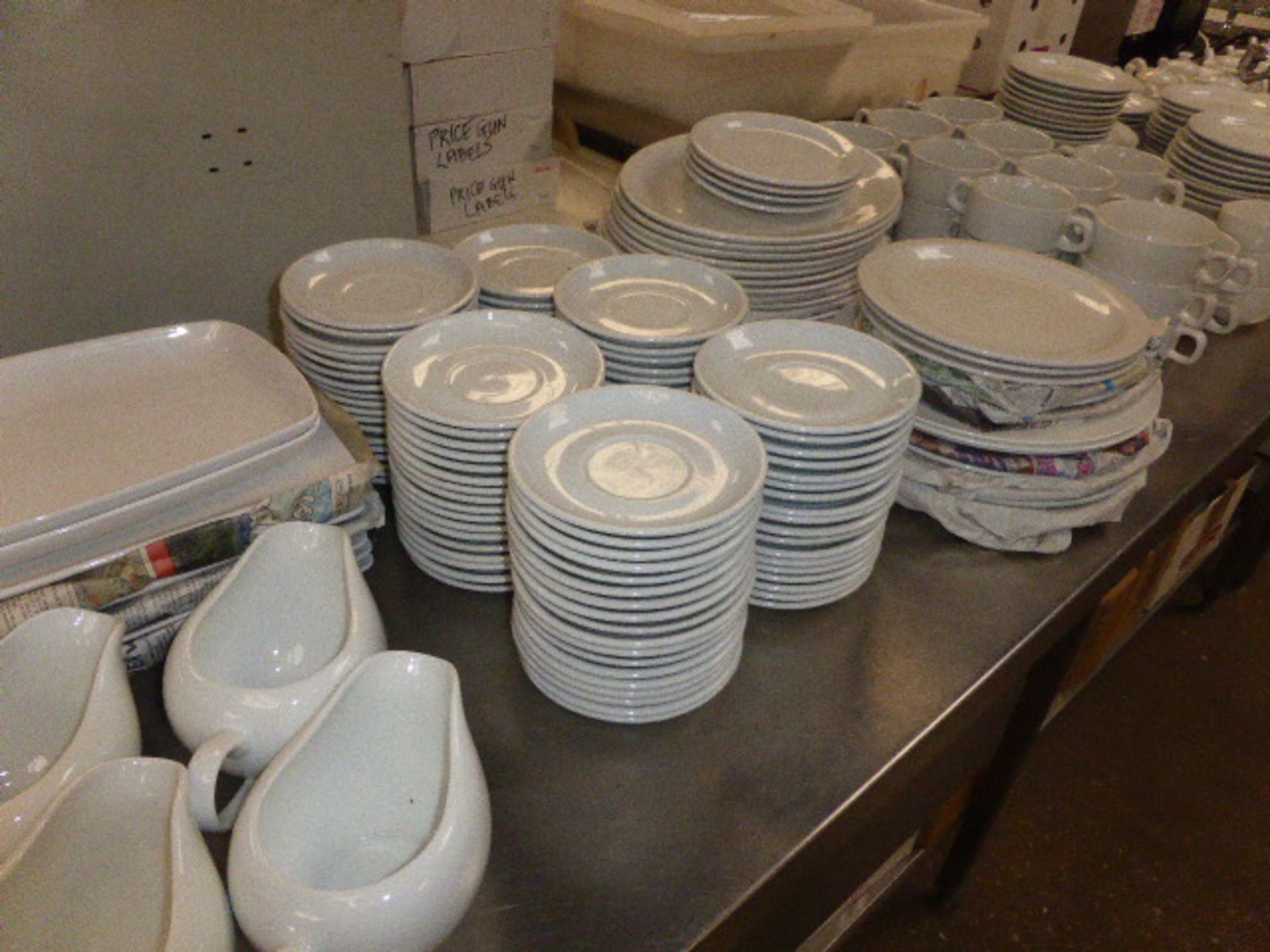 Large quantity of white crockery, including dinner plates, oval plates, soup bowls, side plates,