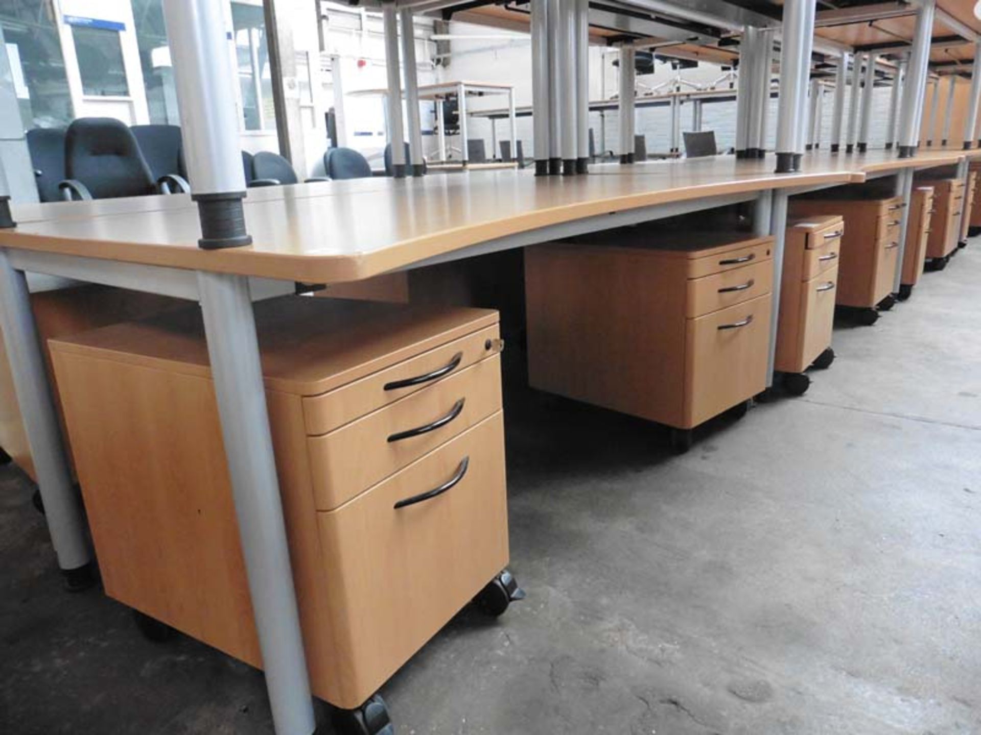 Bank of 5 Werndl beech finish concave fronted work stations on grey tubular legs, each with matching