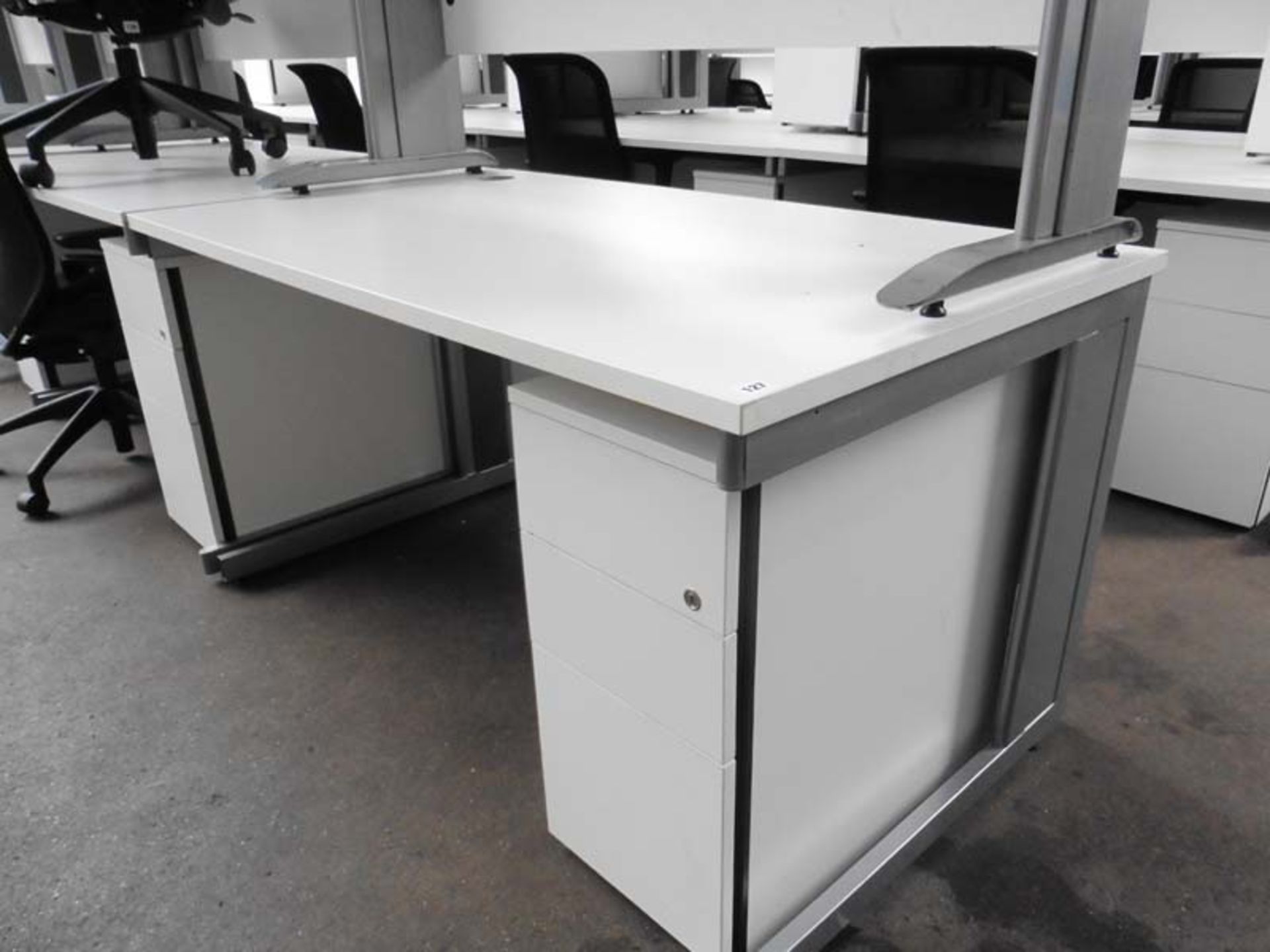 Bank of Seven Sven white work stations with grey cantilever base and matching 2 drawer pedestal,