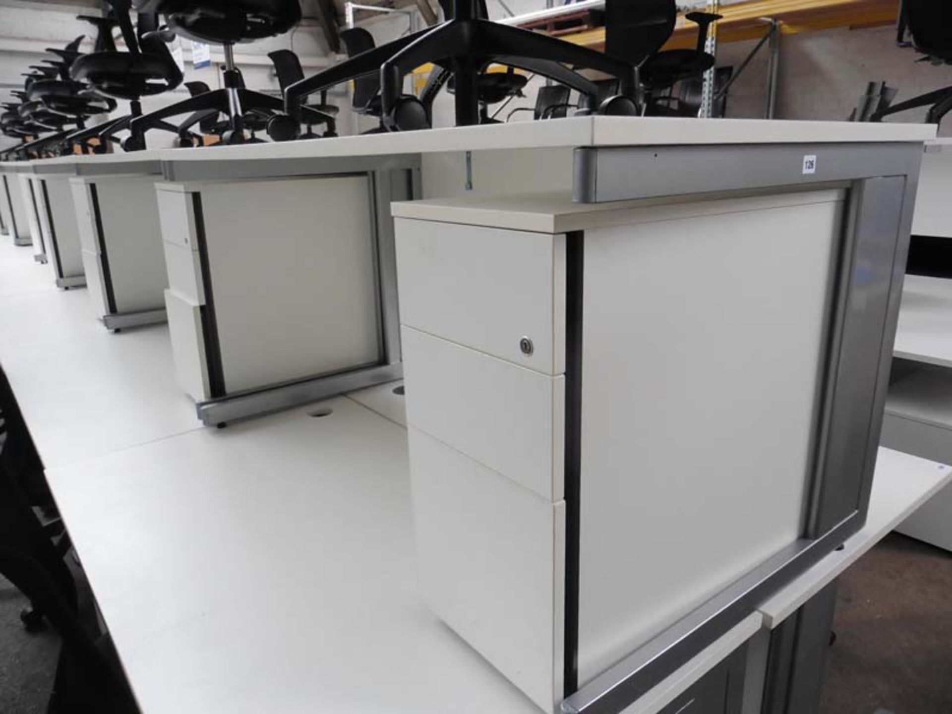 Bank of Seven Sven white work stations with grey cantilever base and matching 2 drawer pedestal,