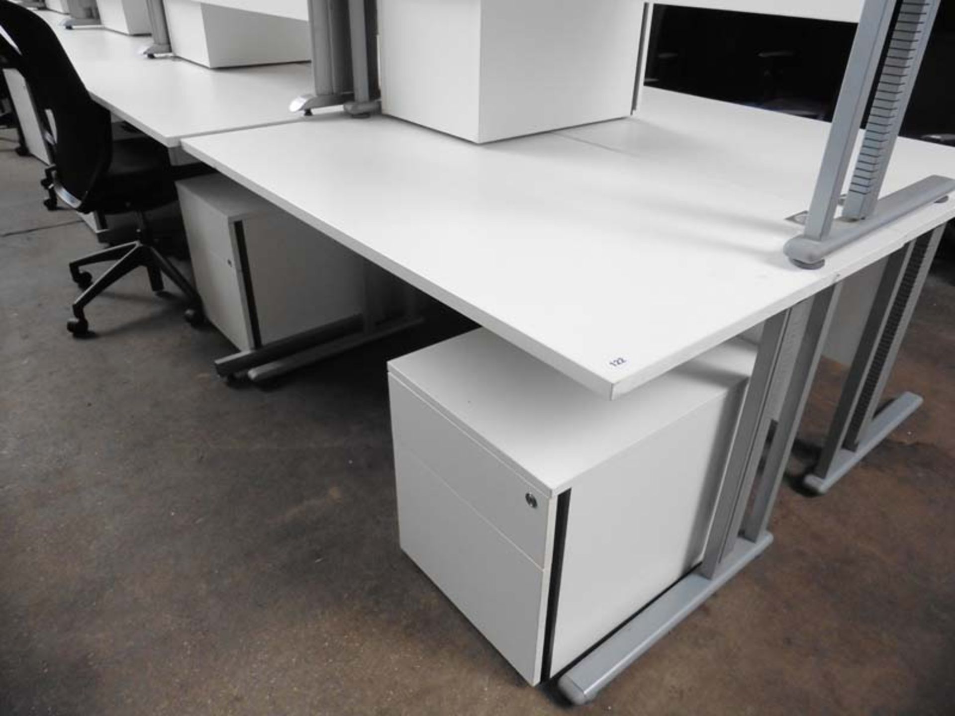 Bank of Seven Sven white work stations with grey cantilever base and matching 2 drawer pedestal,