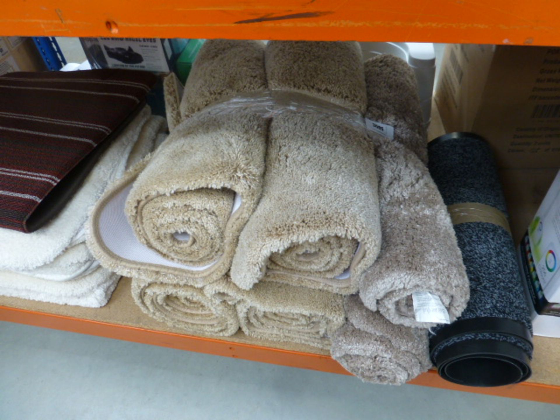 Large qty of bath rugs and 2 outdoor mats