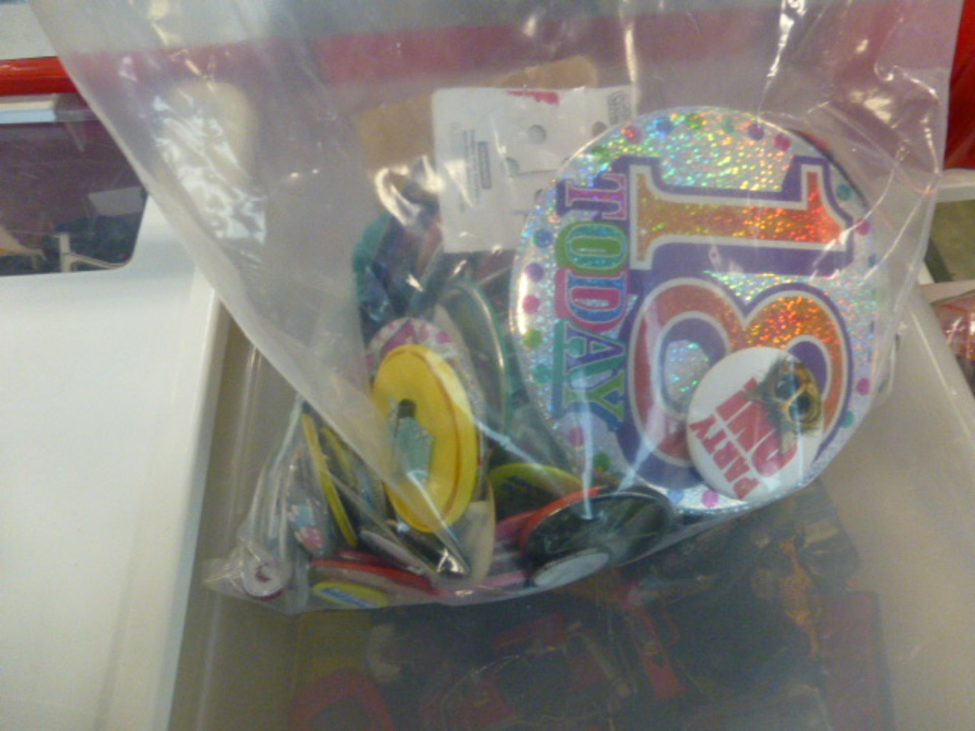 2475 Clear plastic bag of badges