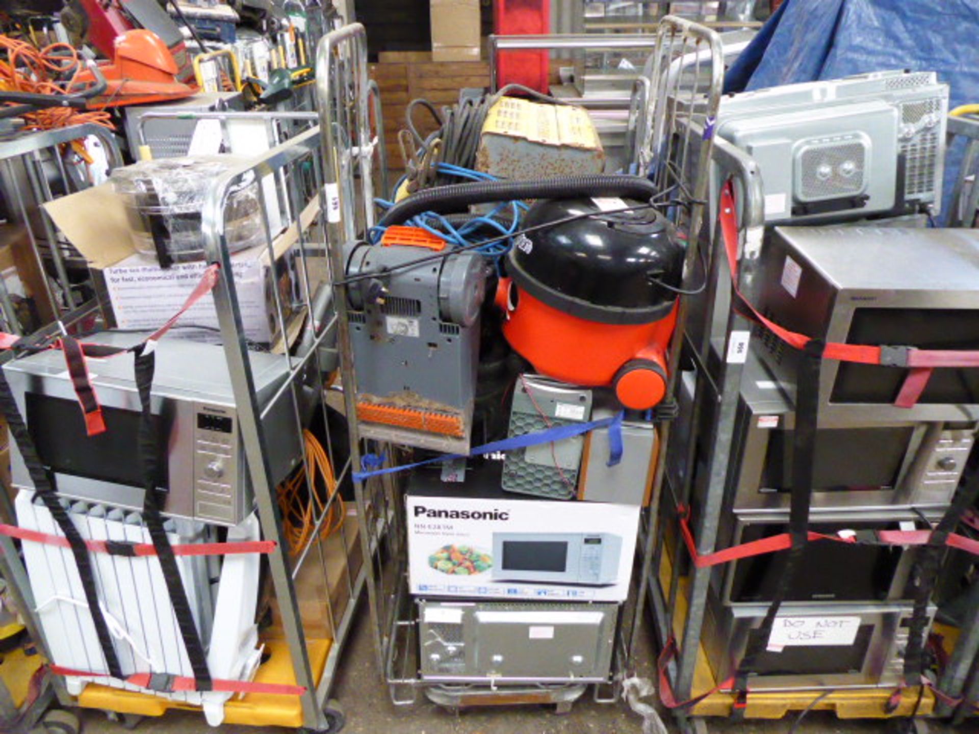 Stillage with contents of trade electrical items for spares or repairs only incl. microwaves, 2