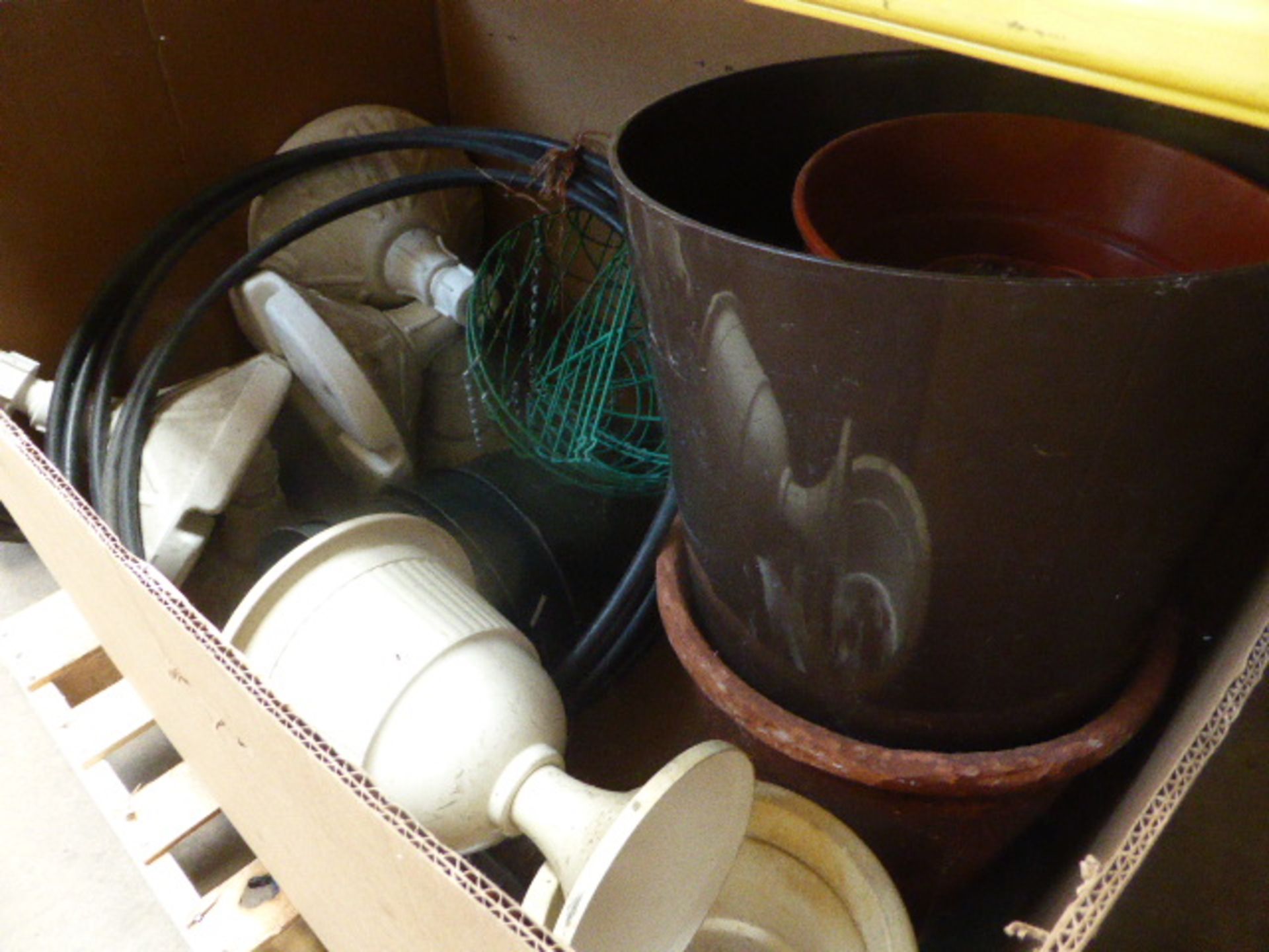 Large box of plastic plant pots