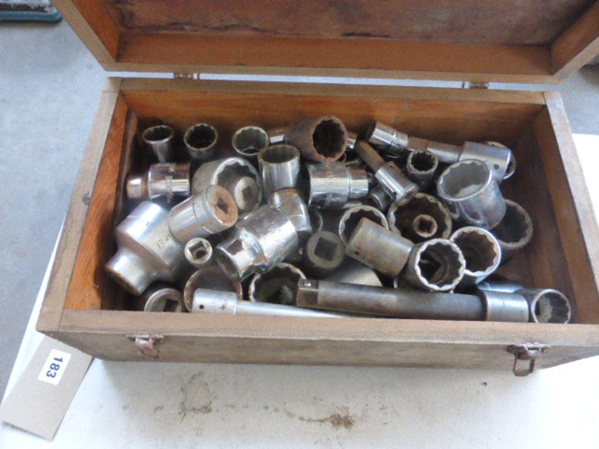 Large wooden box containing assorted size sockets