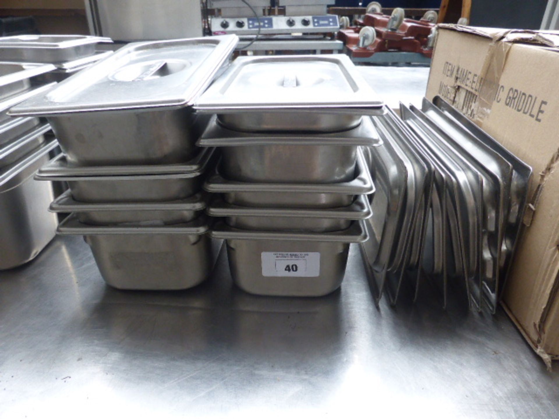 Ten quarter size stainless steel gastronorms with lids