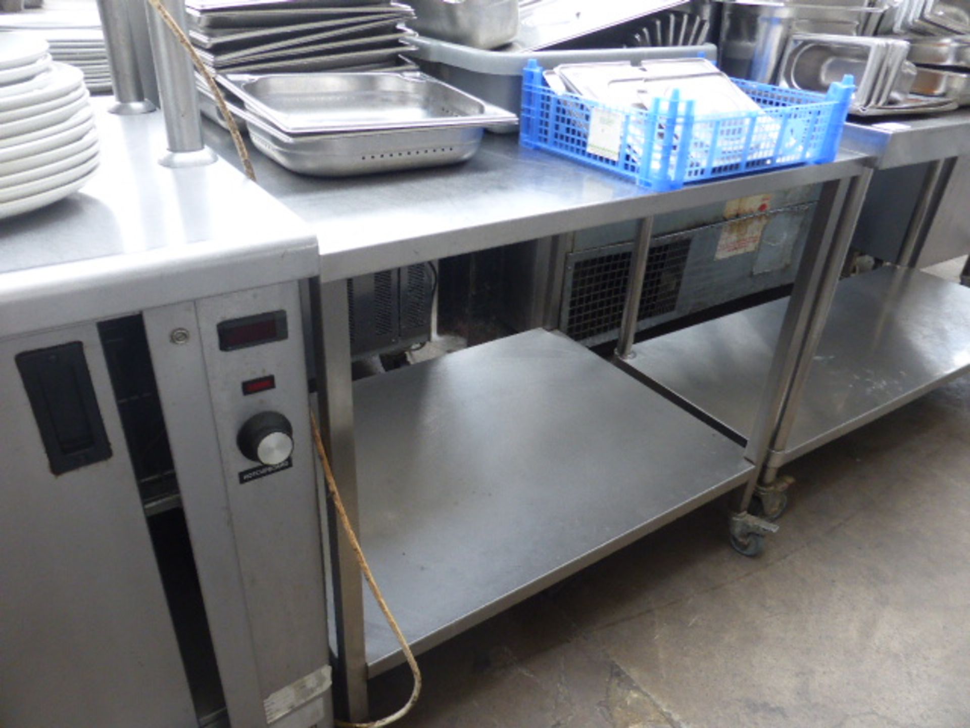 95cm stainless steel preparation table with raised gallery back and shelf under on castors