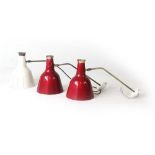 A set of four 1950's red enamelled and pierce work wall lights on brass arms with white enamelled