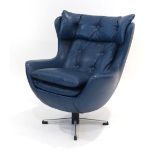 A blue vinyl and button upholstered child's swivel armchair,