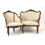 A late 19th century French walnut and upholstered four-piece salon suite in the Louis XV manner,