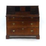 An 18th century and later walnut and crossbanded bureau,