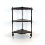 A 19th century rosewood corner what-not-stand with shaped finials,