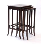 A nest of three late 19th/early 20th century mahogany and strung occasional tables, max. w.