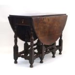 A late 17th/early 18th century oak gateleg table,