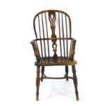 An late 18th/early 19th century elm and ash double hoop Windsor armchair with a spindle back,