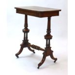 A Victorian walnut side table with a single drawer,