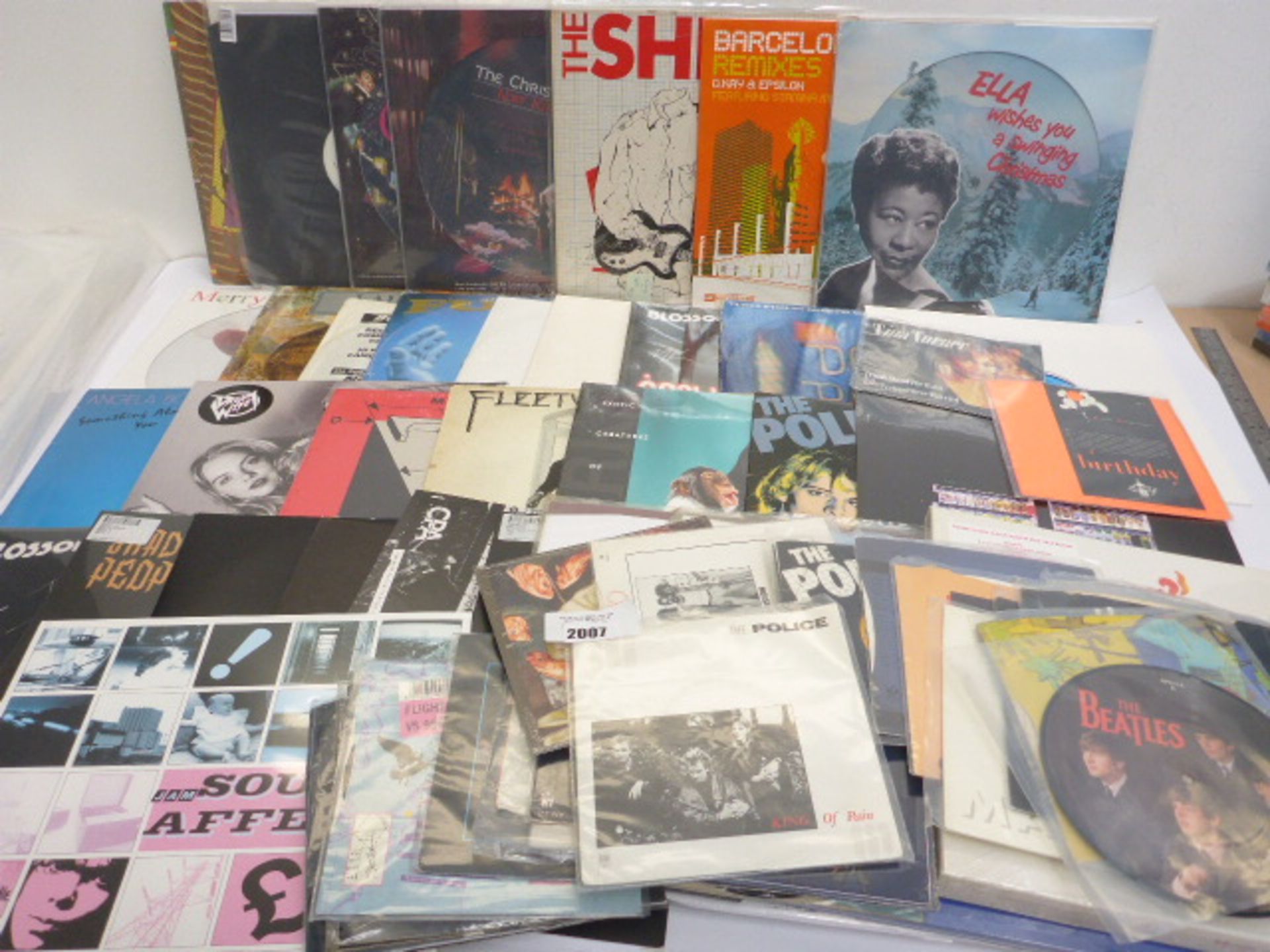 Selection of LP and 45 rpm records including Nat King Cole, Fleetwood Mac, Bing Crosby, Led