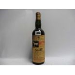 An old bottle of The Old Blend Scotch Whisky of the White Horse Cellar with spring cap,