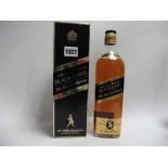 An old bottle of Johnnie Walker Black Label Old Scotch Whisky Extra Special Duty Free label circa