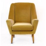 A 1950's pale green upholstered armchair with beech tapering legs CONDITION REPORT: