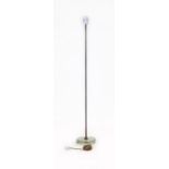 An FLB Swedish floor lamp with a glass base and copper shaft