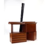 A 1960/70's teak modular shelving system including a chest, an open box-shelf, two cabinets,