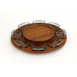 A Danish teak lazy susan by Digsmed, with French moulded glass trays, d.