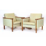 A pair of Danish 1960's cream upholstered lounge armchairs,