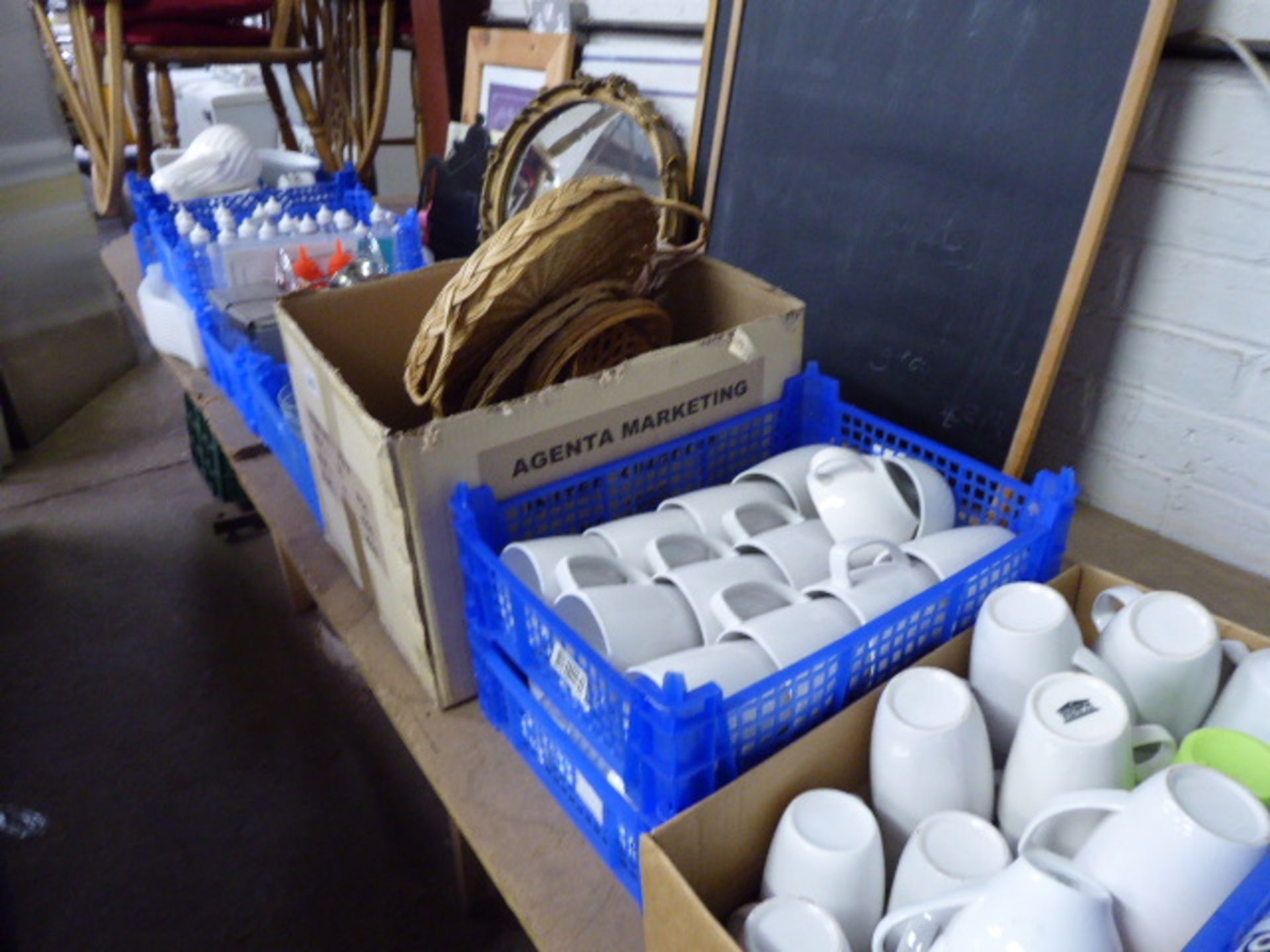 11 plastic trays and boxes of assorted mugs, cups, glassware, trays etc.