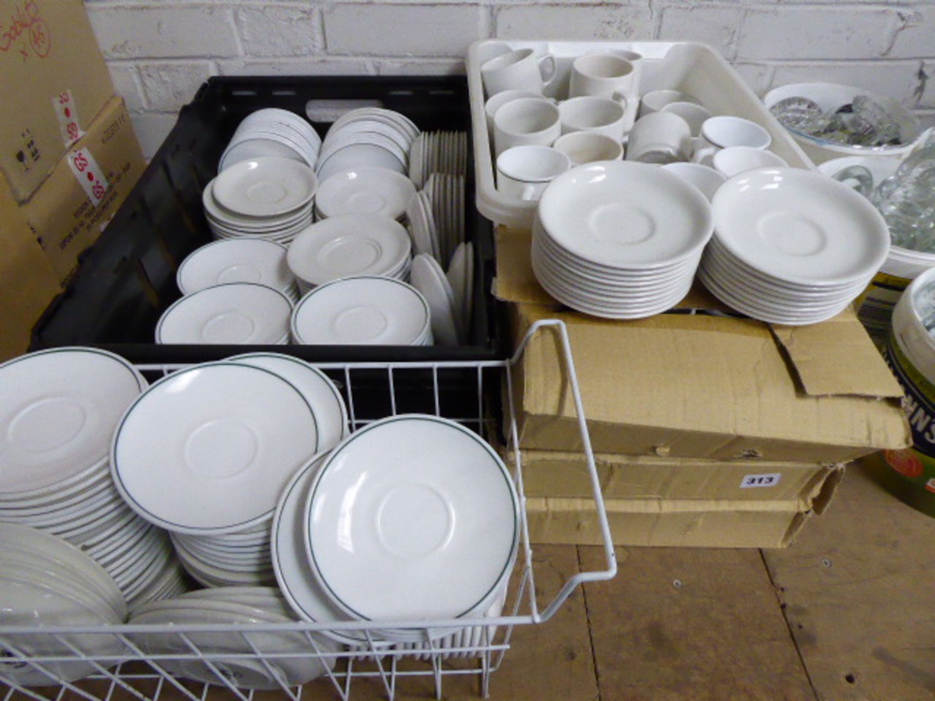 Large quantity of mugs and cups with saucers