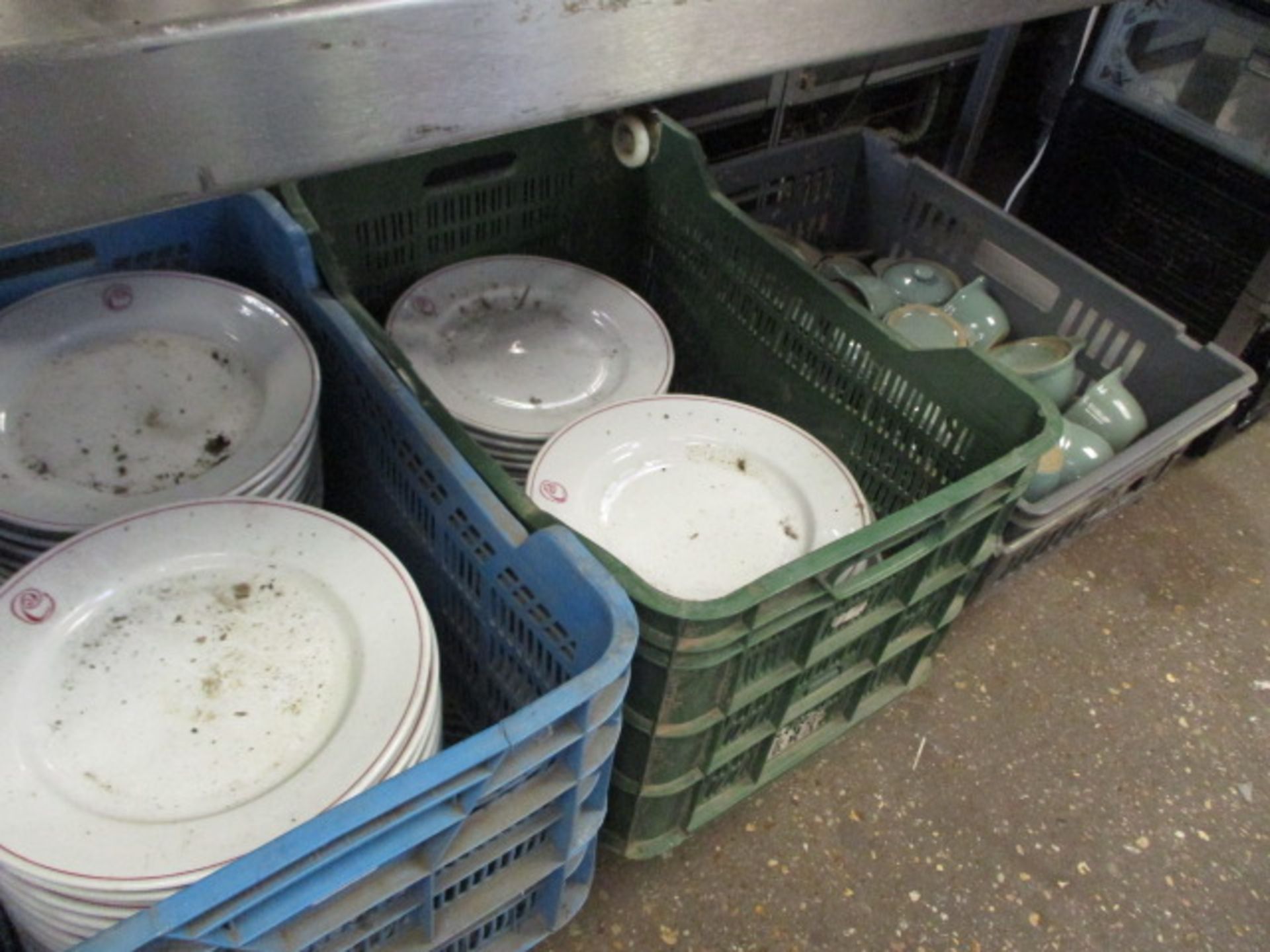 2 tray containing La Porcellana plates with red rim and tray of Denby small casserole dishes