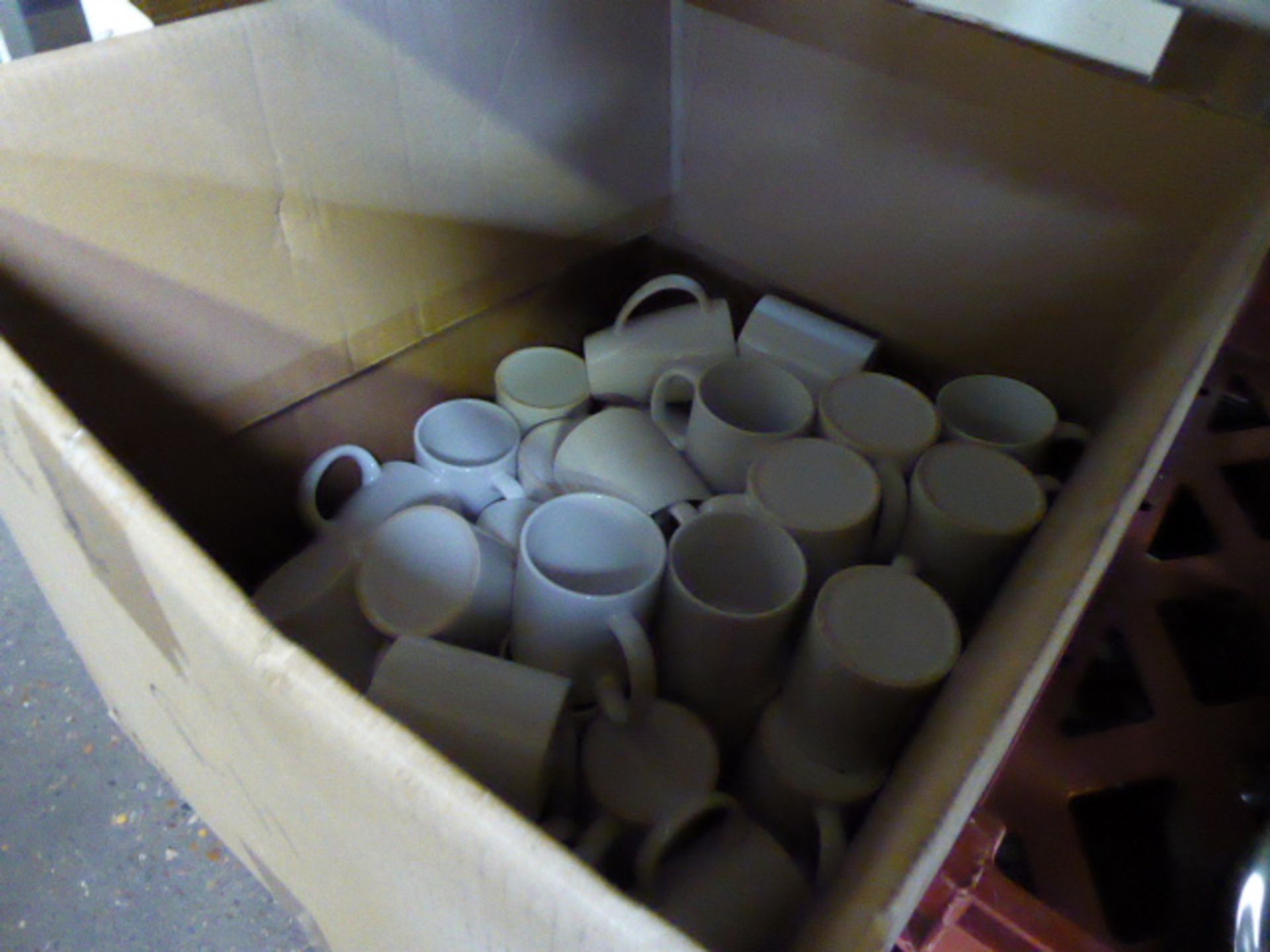 Large box of white mugs