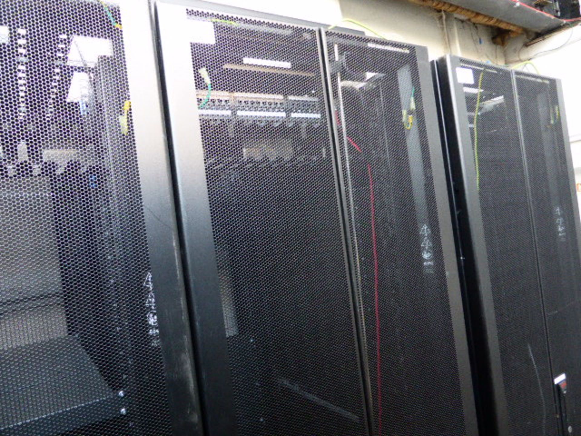 APC server cabinet on castors 60cm wide with 2 APC switch rack PDU units each with 24 outputs on