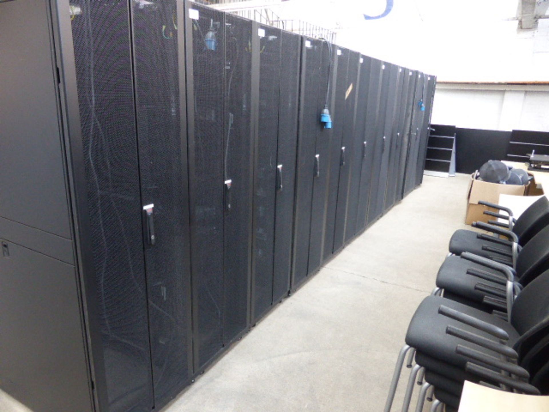 APC server cabinet on castors 60cm wide with 2 APC switch rack PDU units each with 24 outputs on