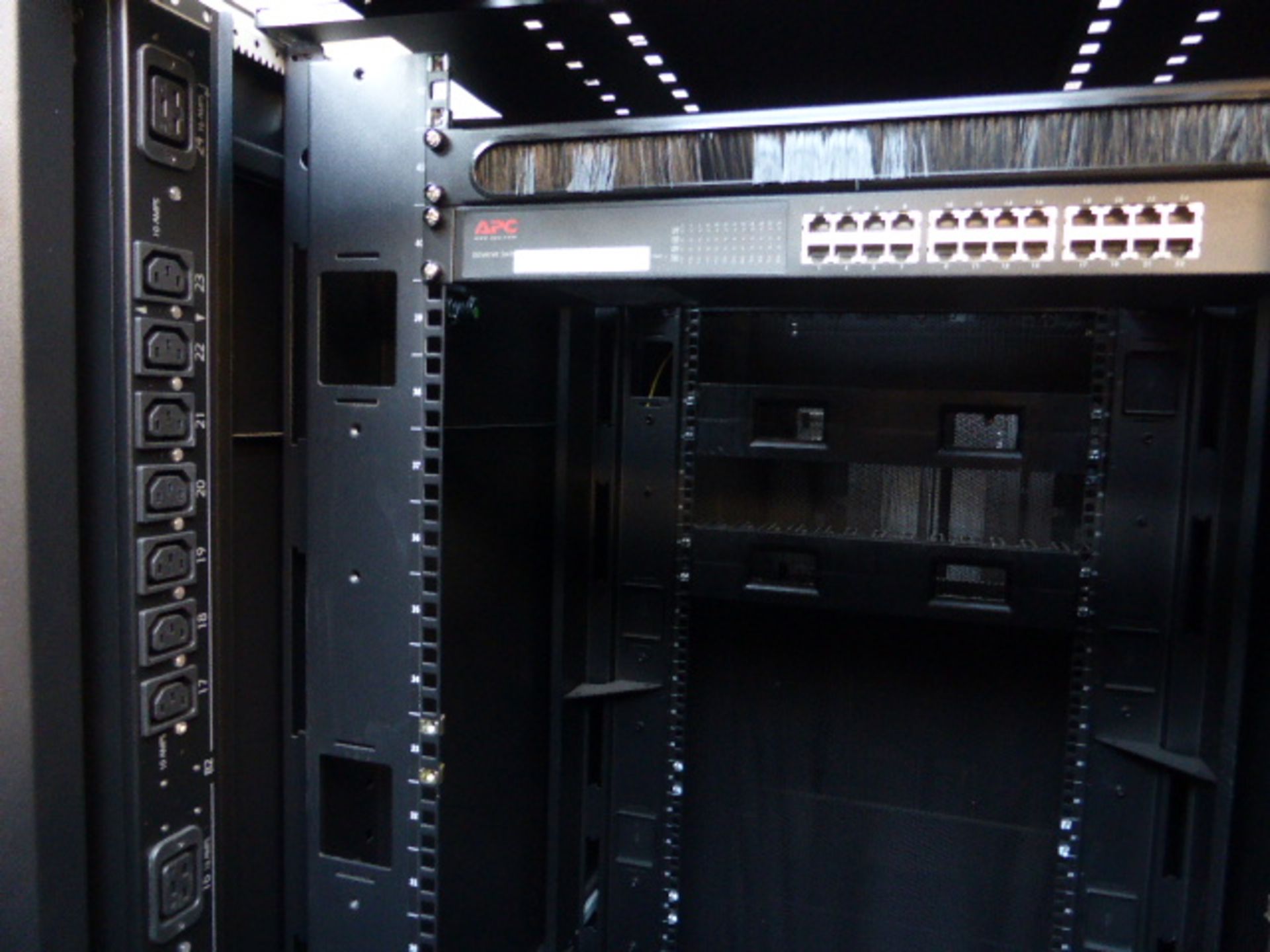 APC server cabinet on castors 75cm wide with 2 APC switch rack PDU units each with 24 outputs on - Image 2 of 3