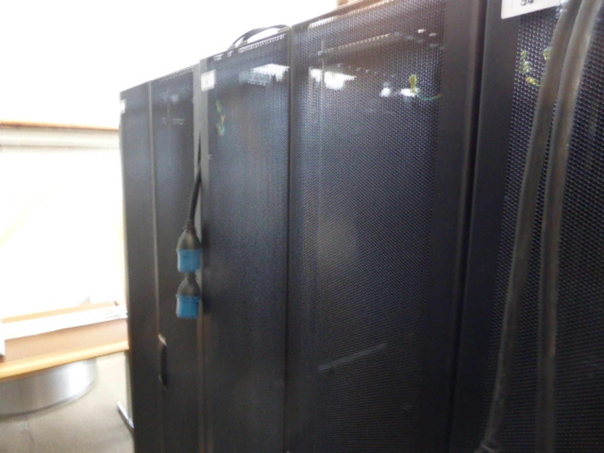 APC server cabinet on castors 75cm wide with 2 APC switch rack PDU units each with 24 outputs on