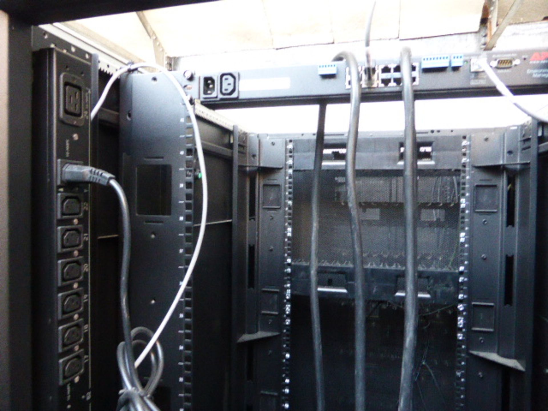 APC server cabinet on castors 75cm wide with 2 APC switch rack PDU units each with 24 outputs on - Image 2 of 3