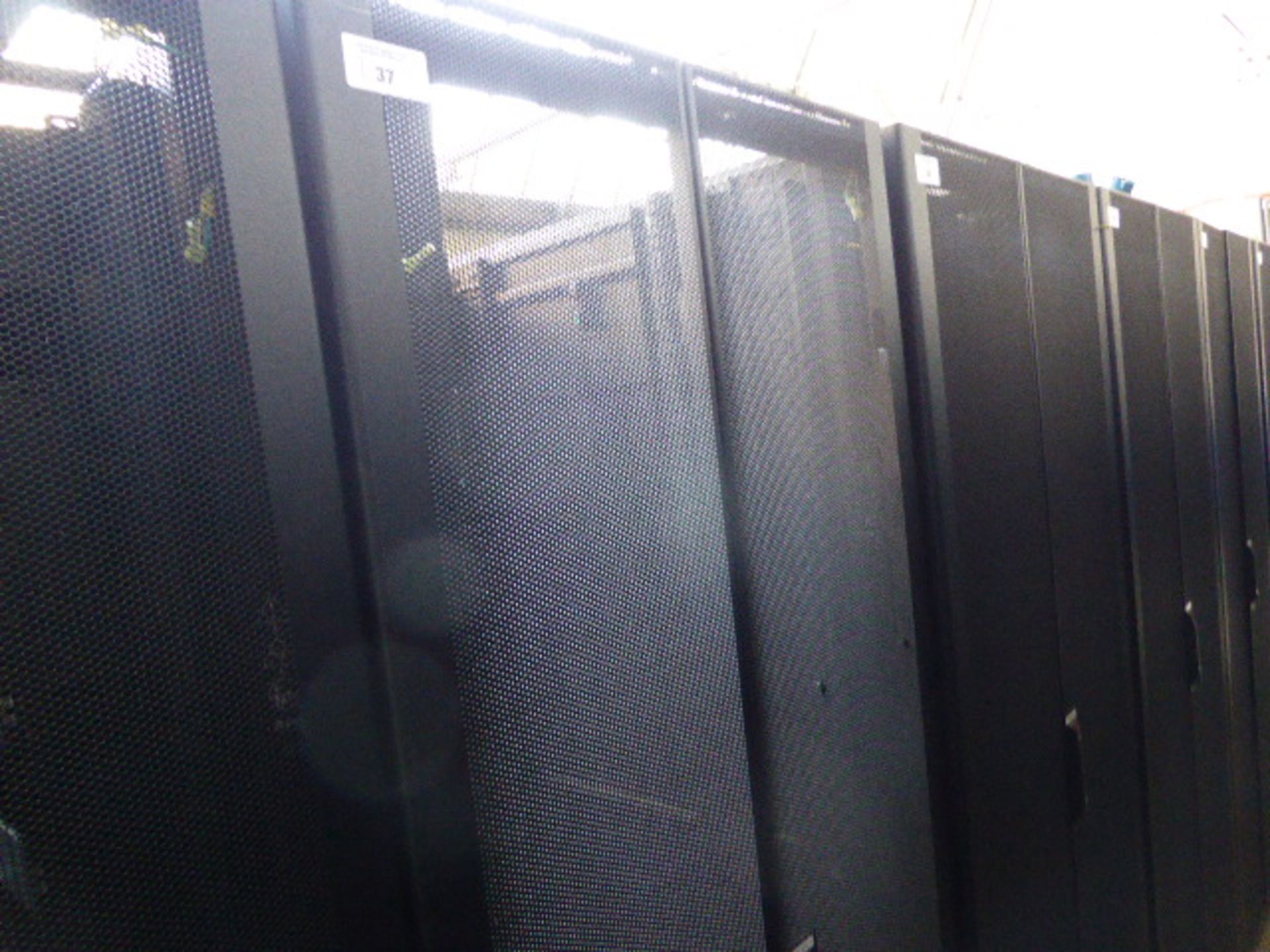 APC server cabinet on castors 75cm wide with 2 APC switch rack PDU units each with 24 outputs on