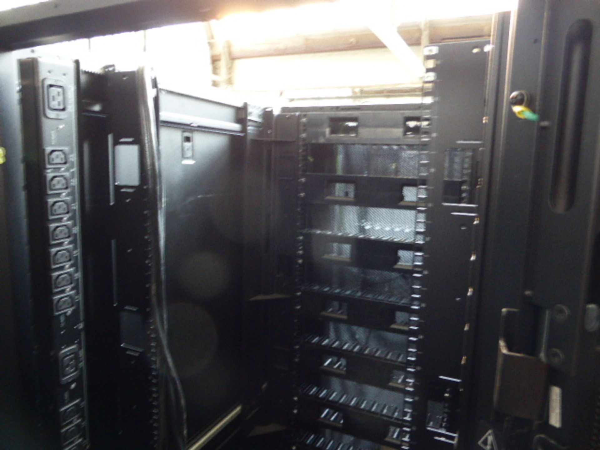 APC server cabinet on castors 75cm wide with 2 APC switch rack PDU units each with 24 outputs on - Image 2 of 2