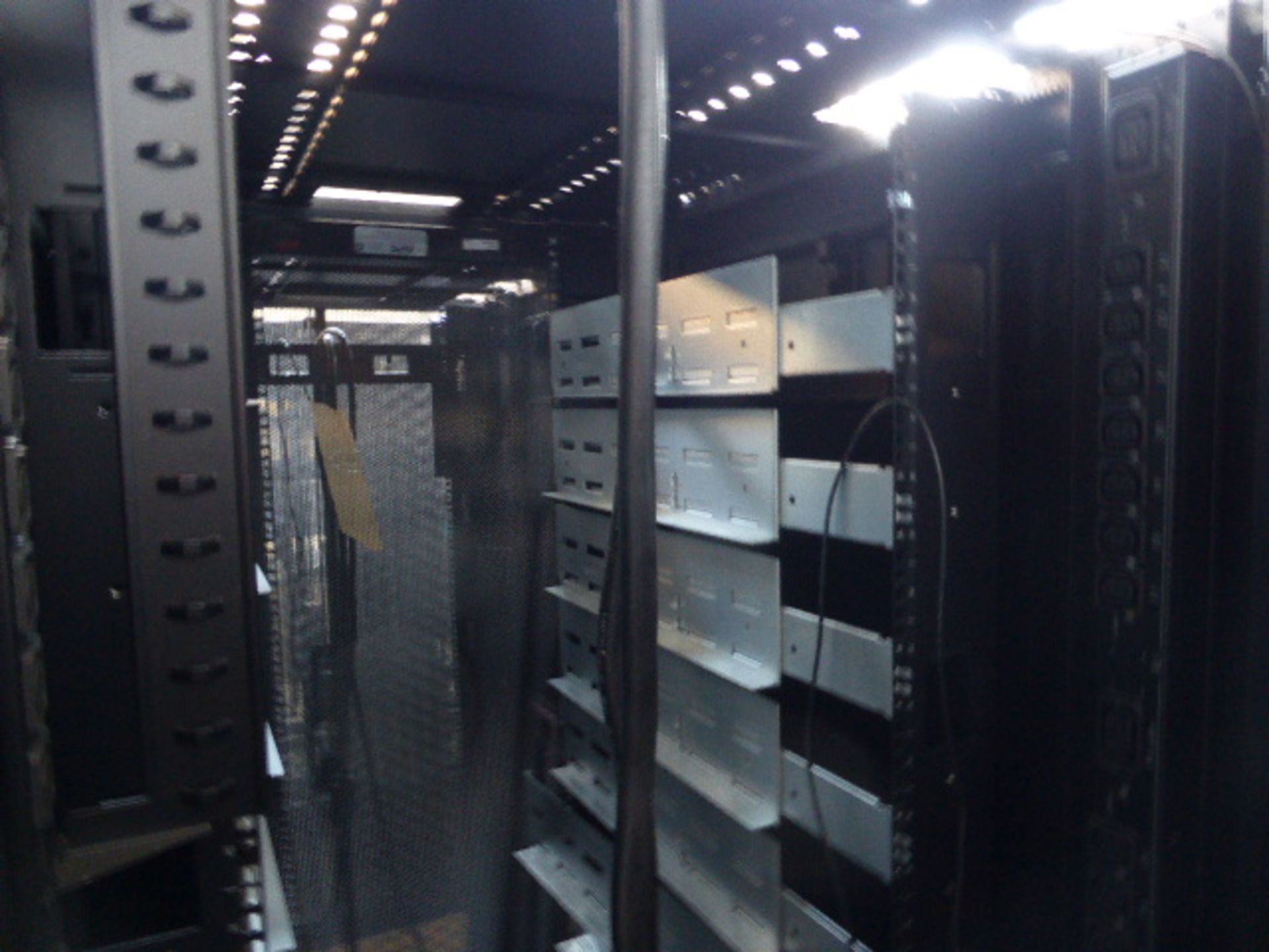 APC server cabinet on castors 75cm wide with 2 APC switch rack PDU units each with 24 outputs on - Image 2 of 2