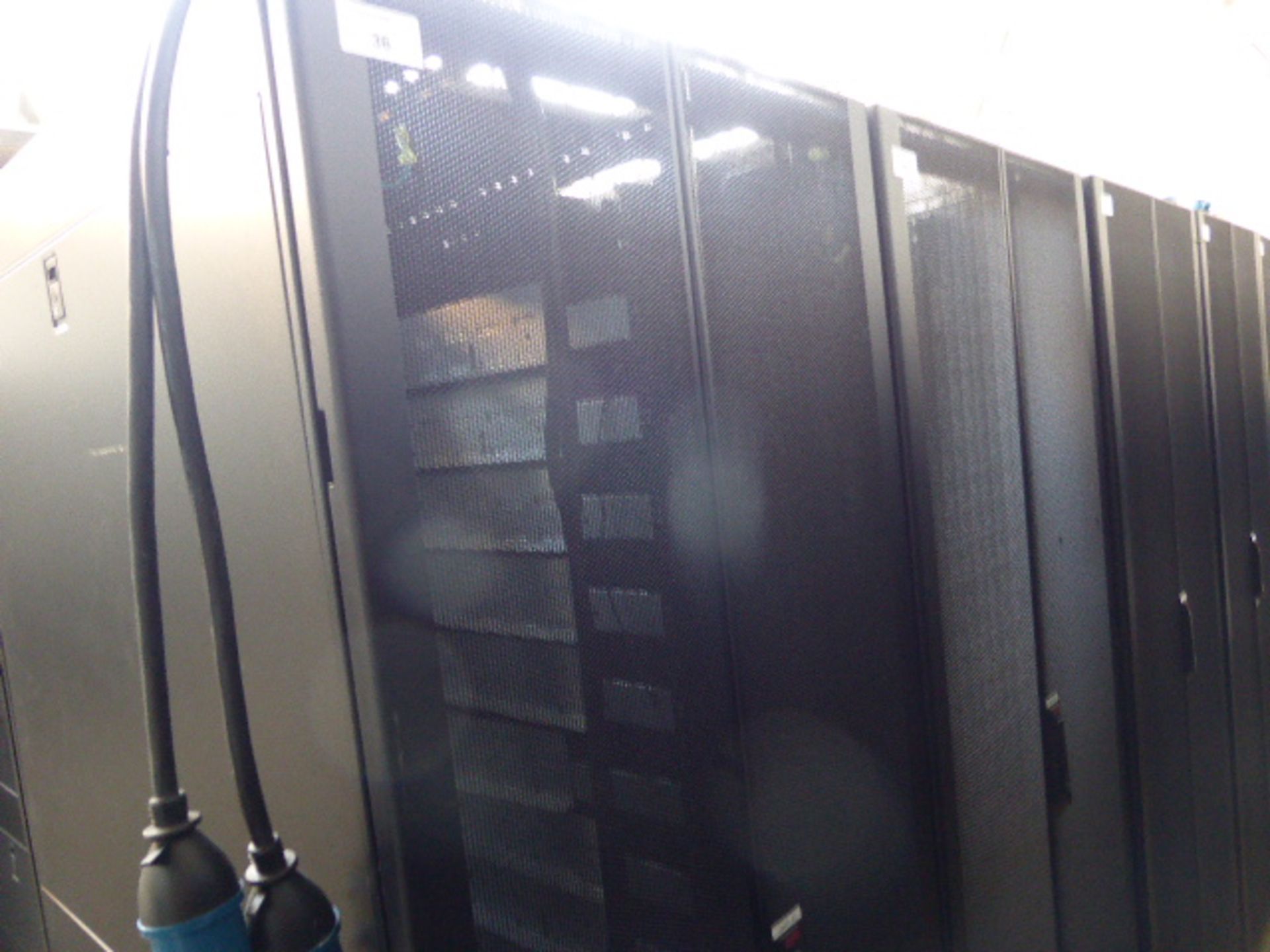 APC server cabinet on castors 75cm wide with 2 APC switch rack PDU units each with 24 outputs on