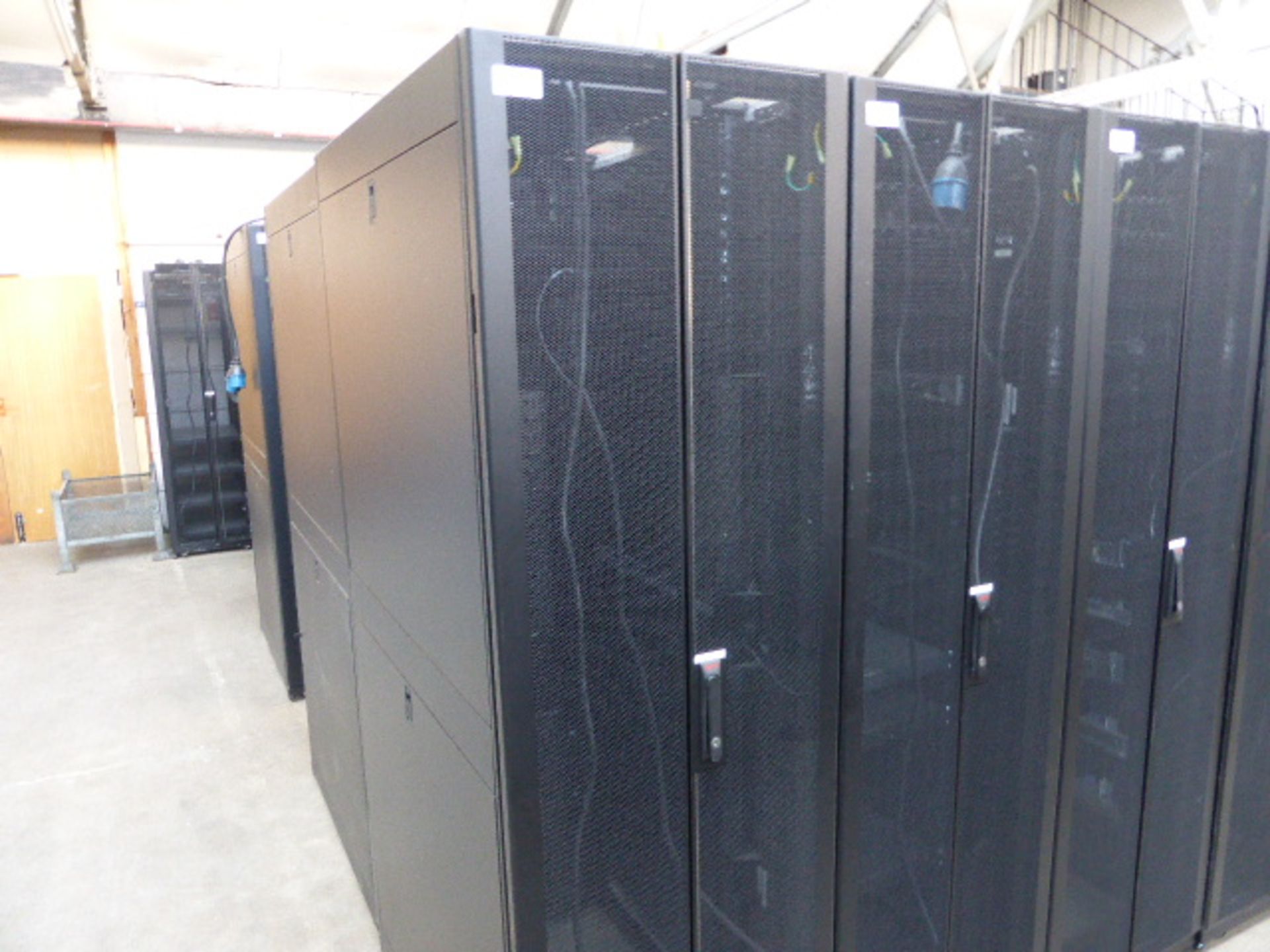 APC server cabinet on castors 60cm wide with 2 APC switch rack PDU units each with 24 outputs on - Image 2 of 3