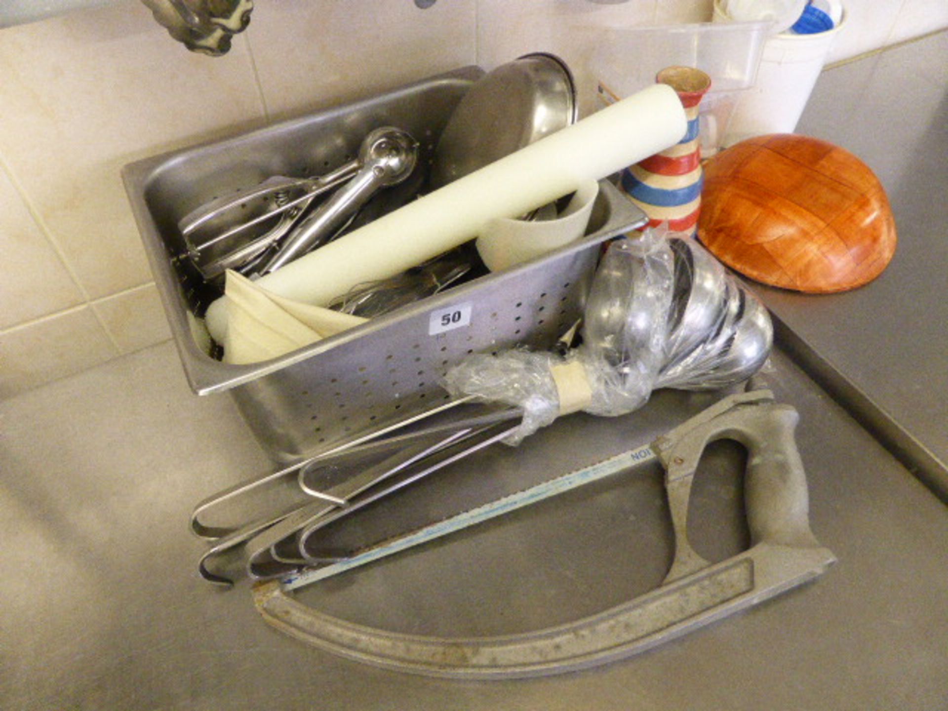Range of utensils in dish wash area including serving tongs, whisks, pasta spoons, slotted spoons, - Image 2 of 4