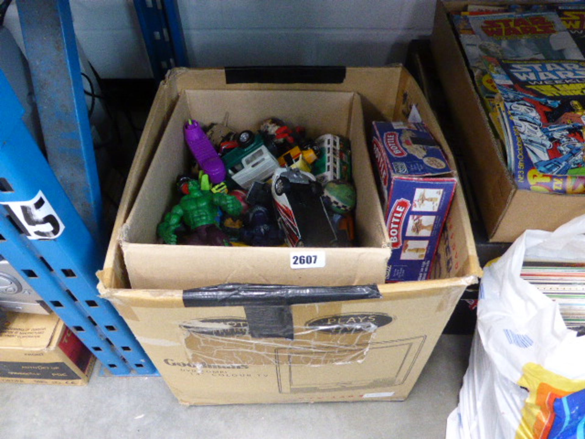 Cardboard boxes of mixed toys incl. model cars, figurines, etc.