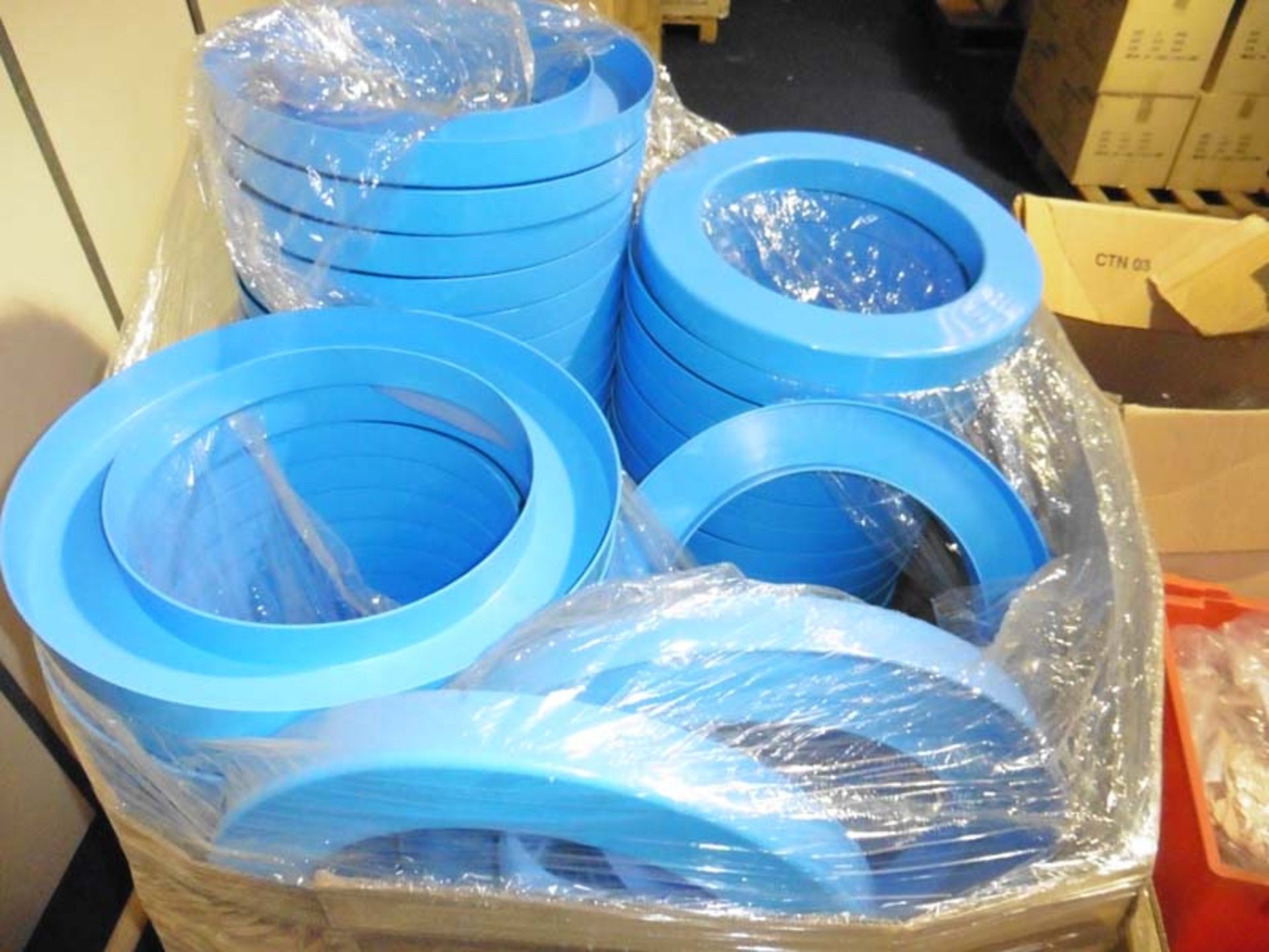 Pallet of blue circular sand play disks