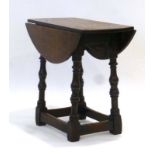 An 18th century and later oak occasional table, the drop-leaf surface on a joint stool base, d.